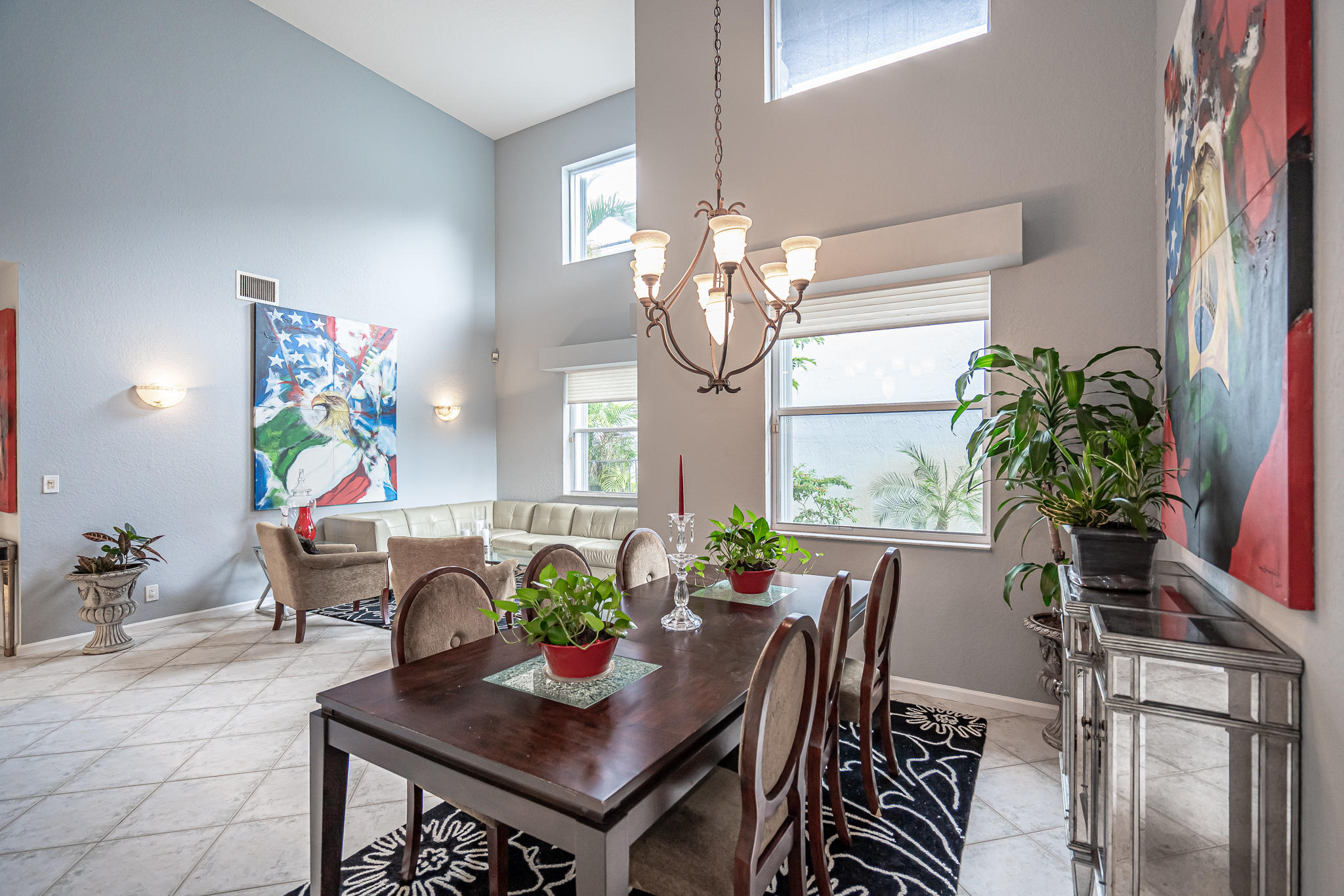 22821 Chelsea Wood Court Boca Raton, FL 33433 - Photo 5 of 43 a view of a dining room with furniture and chandelier