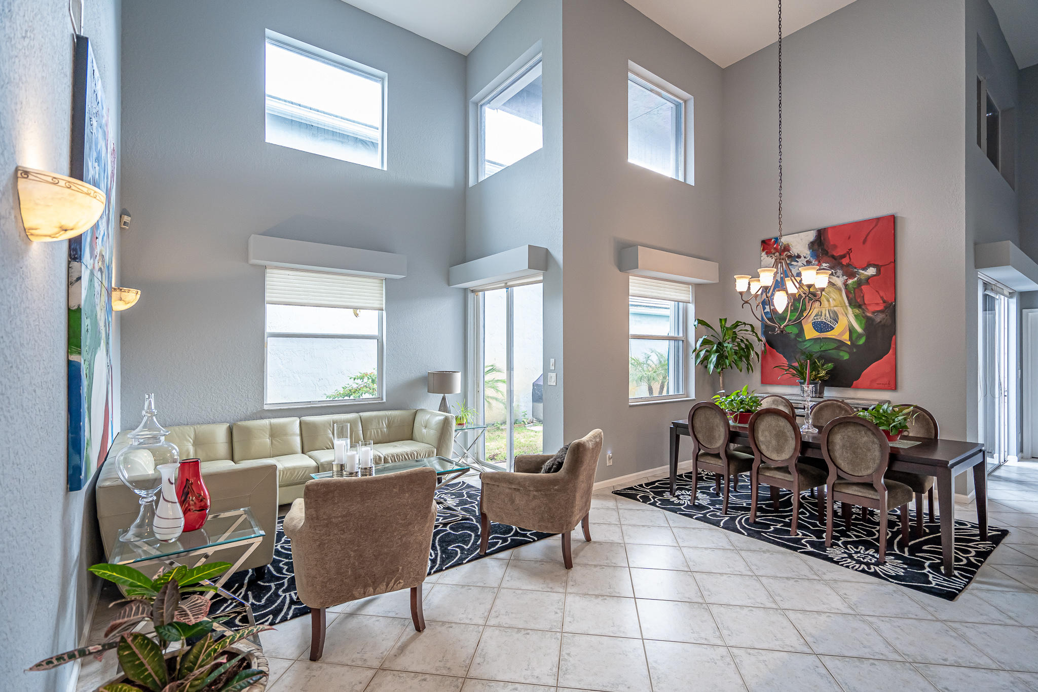 22821 Chelsea Wood Court Boca Raton, FL 33433 - Photo 6 of 43 a living room filled with furniture and a potted plant