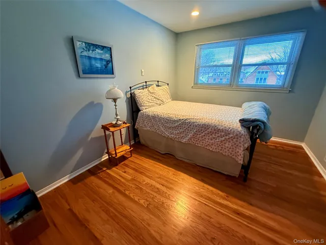 a bedroom with bed and a window
