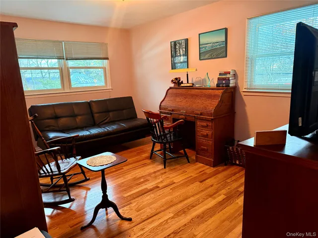 a workspace with furniture and window