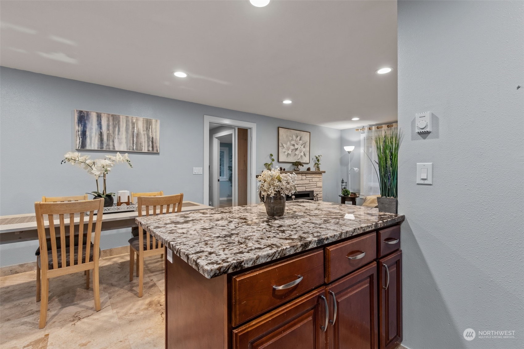 15608 Southeast 128th Street Renton, WA 98059 - Photo 11 of 40 a kitchen with a table and chairs in it
