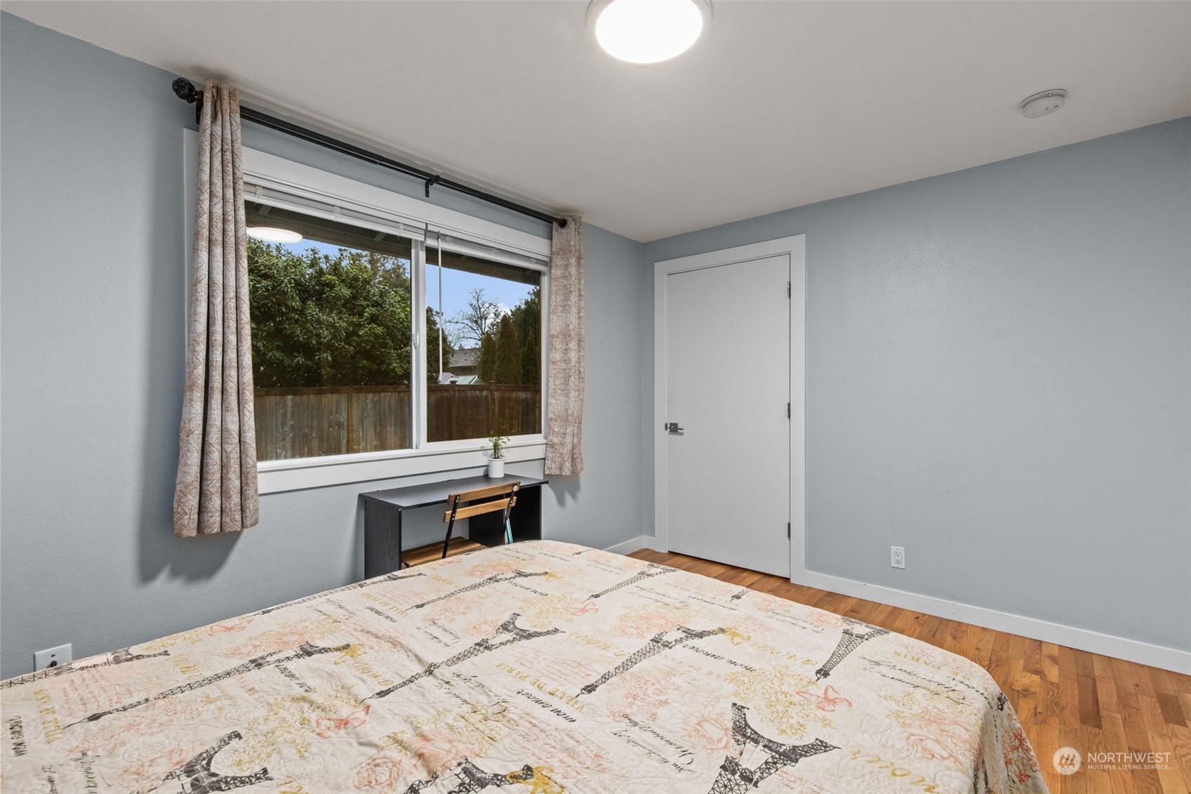15608 Southeast 128th Street Renton, WA 98059 - Photo 19 of 40 a bedroom with a bed and a large window