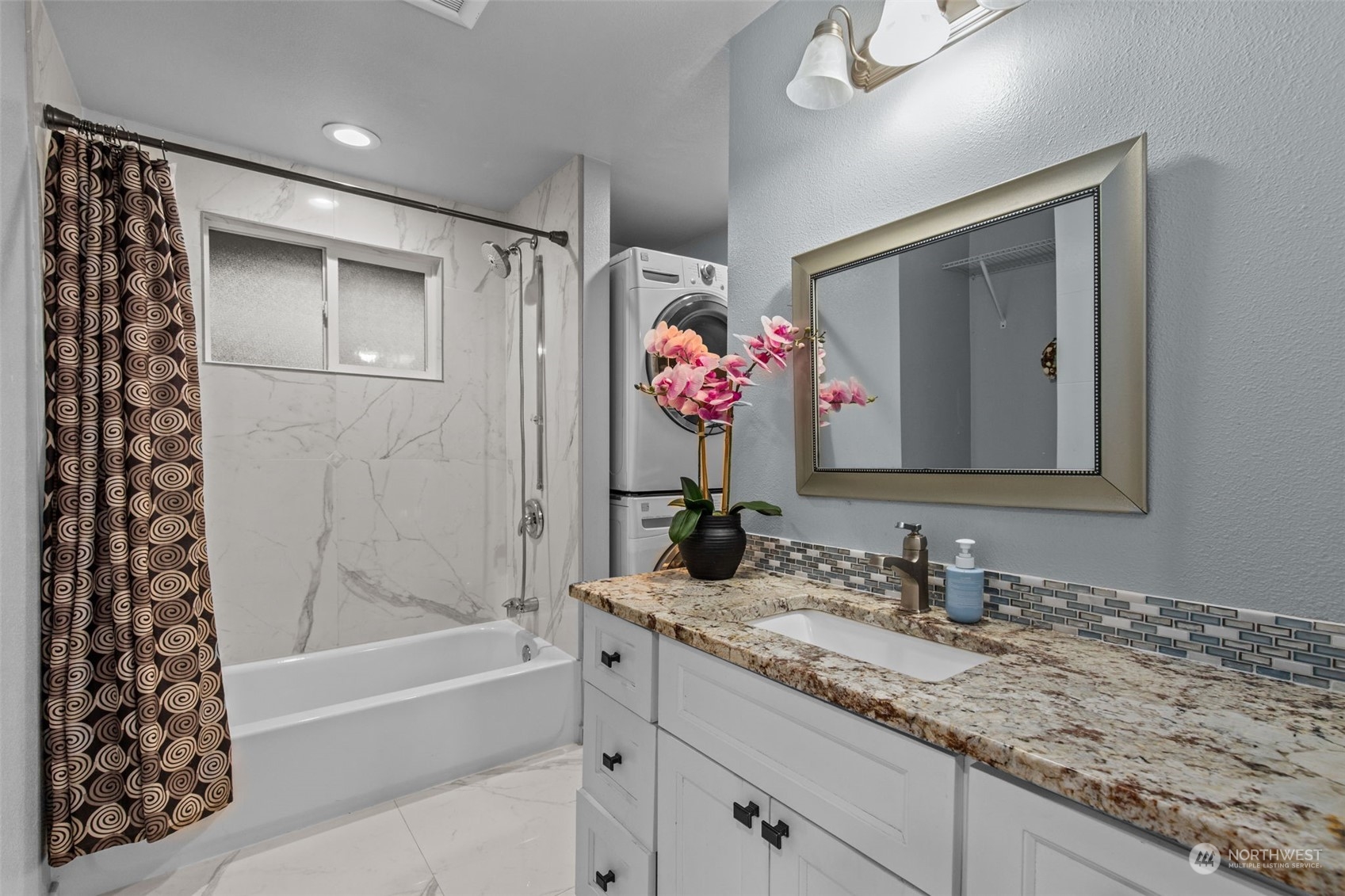 15608 Southeast 128th Street Renton, WA 98059 - Photo 24 of 40 a bathroom with a granite countertop sink mirror and a bath tub