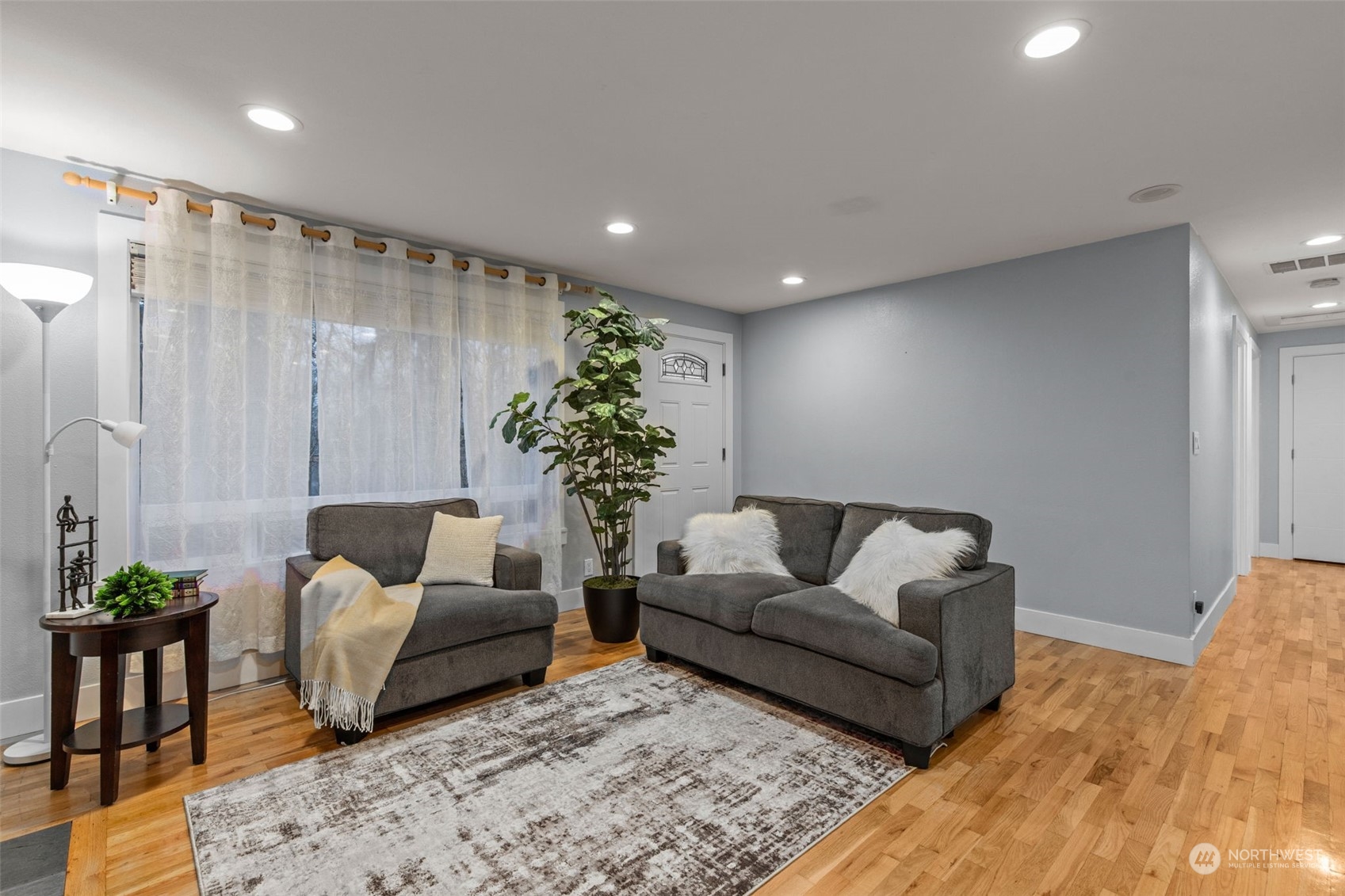 15608 Southeast 128th Street Renton, WA 98059 - Photo 3 of 40 a living room with furniture and a potted plant