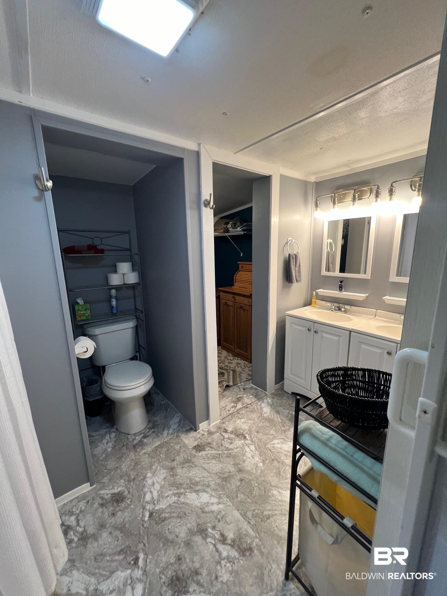 1420 Ridgewood Circle Lillian, AL 36549 - Photo 10 of 41 Bathroom with vanity and toilet