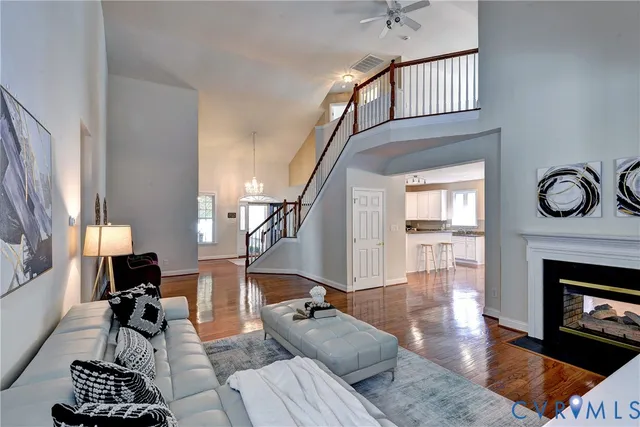 a living room with furniture a rug and a fireplace