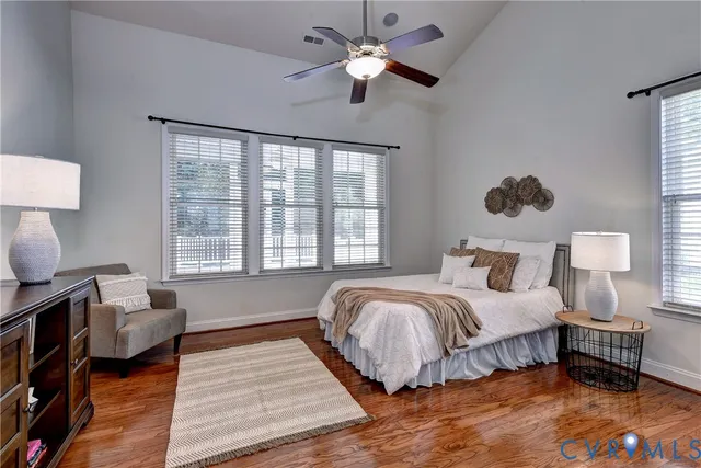 a spacious bathroom with a tub sink shower and mirror