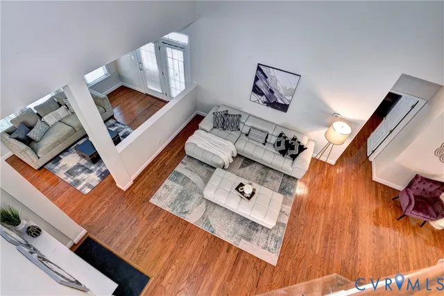 a view of wooden floor and windows in a room