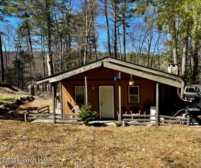 a view of a house with snow on the road