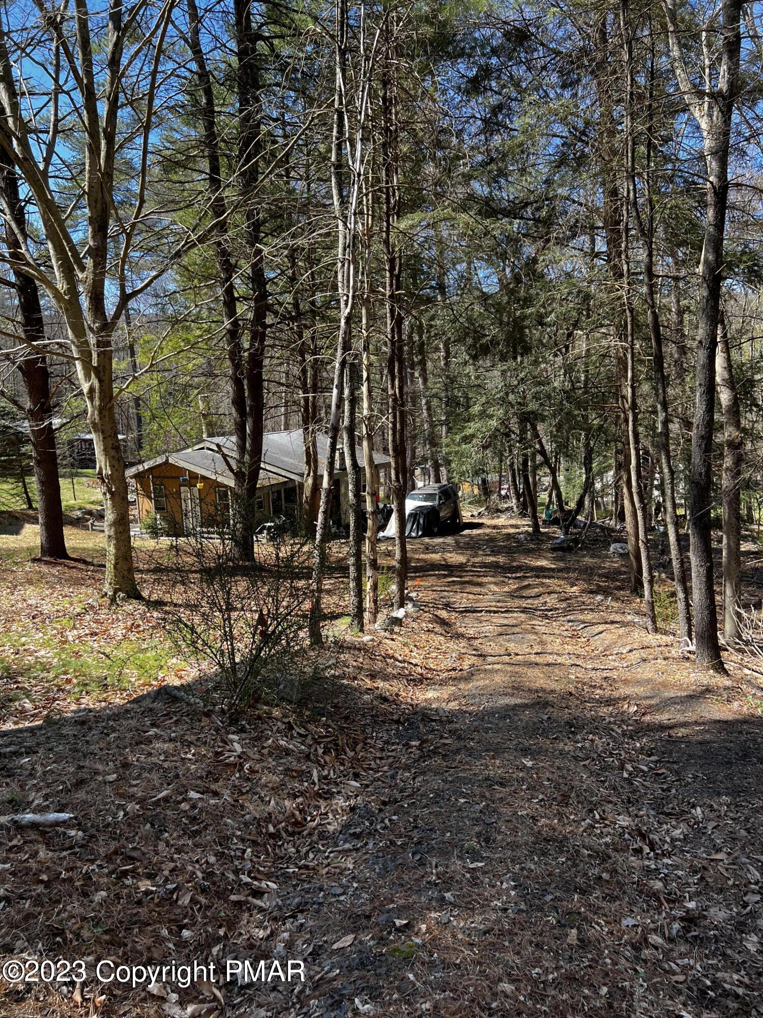 108 Mink Lane Bushkill, PA 18324 - Photo 13 of 15 a backyard of a house with lots of green space
