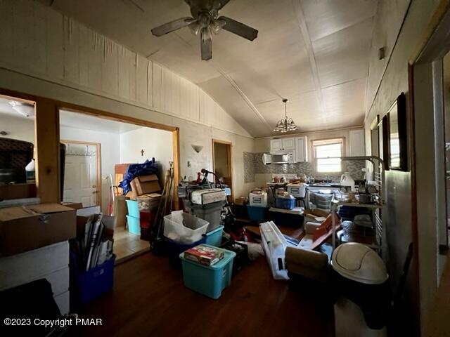 108 Mink Lane Bushkill, PA 18324 - Photo 5 of 15 a living room with lots of furniture and gym equipment