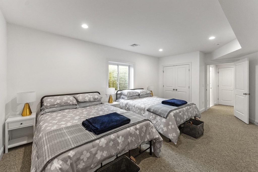 23 Rosewood Circle Mashpee, MA 02649 - Photo 27 of 32 a bedroom with two beds and a couch