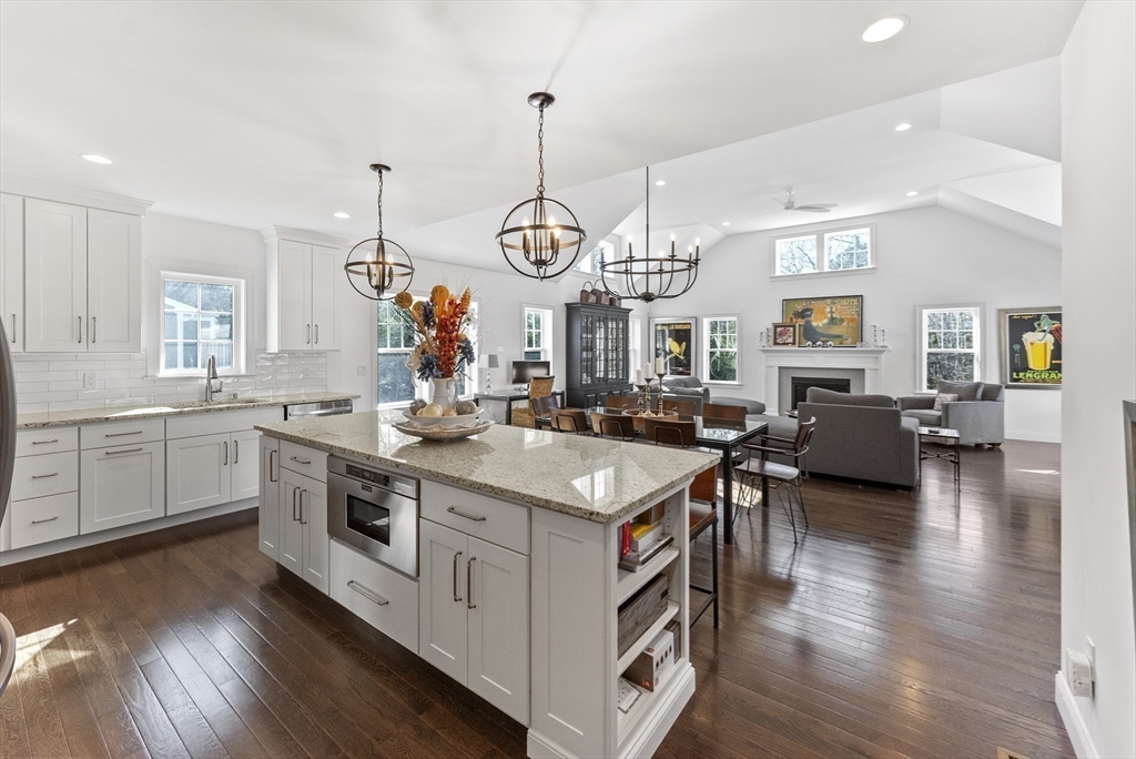 23 Rosewood Circle Mashpee, MA 02649 - Photo 7 of 32 a kitchen with a sink stove and wooden floor