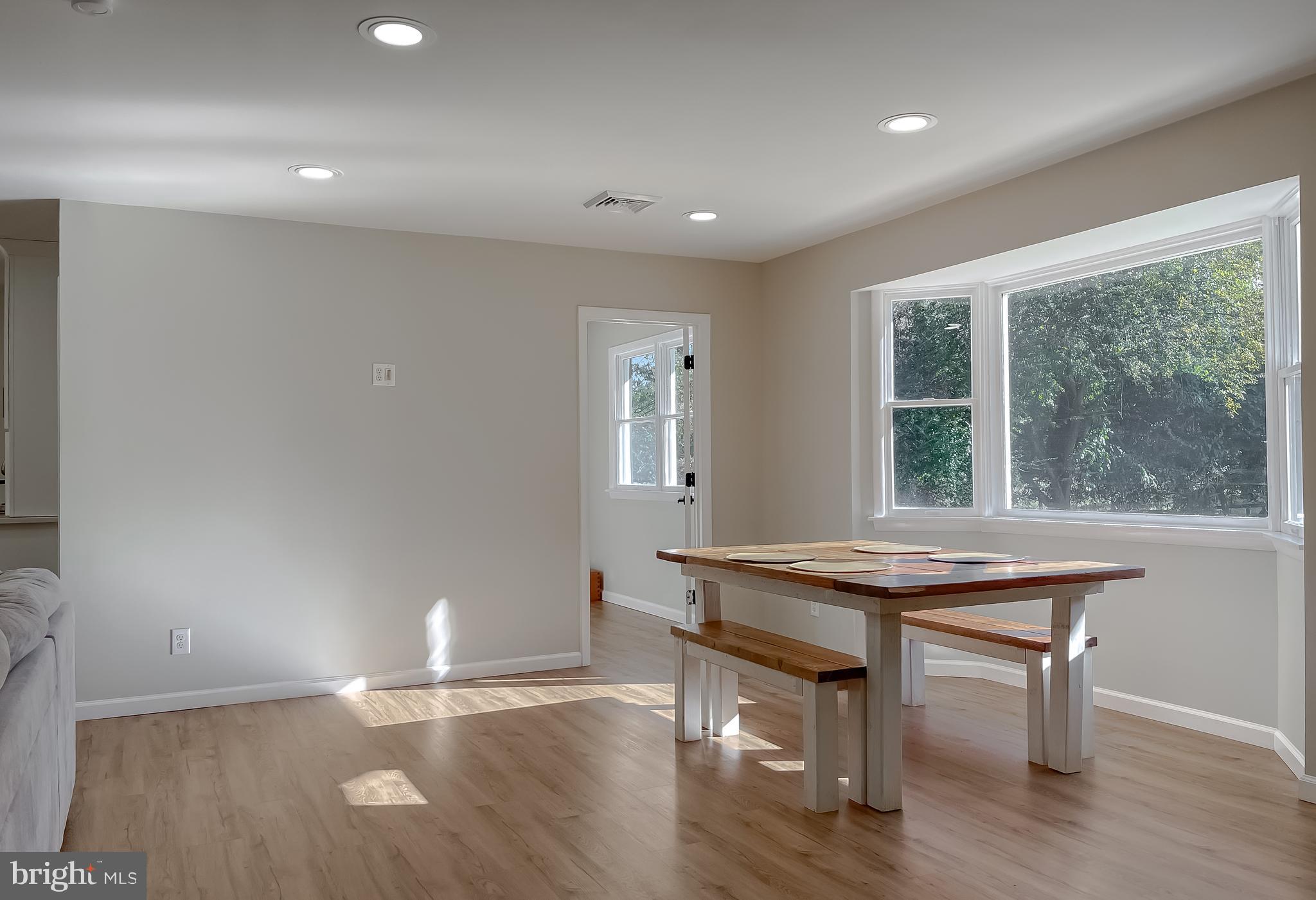 26005 Jones Wharf Road Hollywood, MD 20636 - Photo 11 of 66 a view of a room with wooden floor and a window