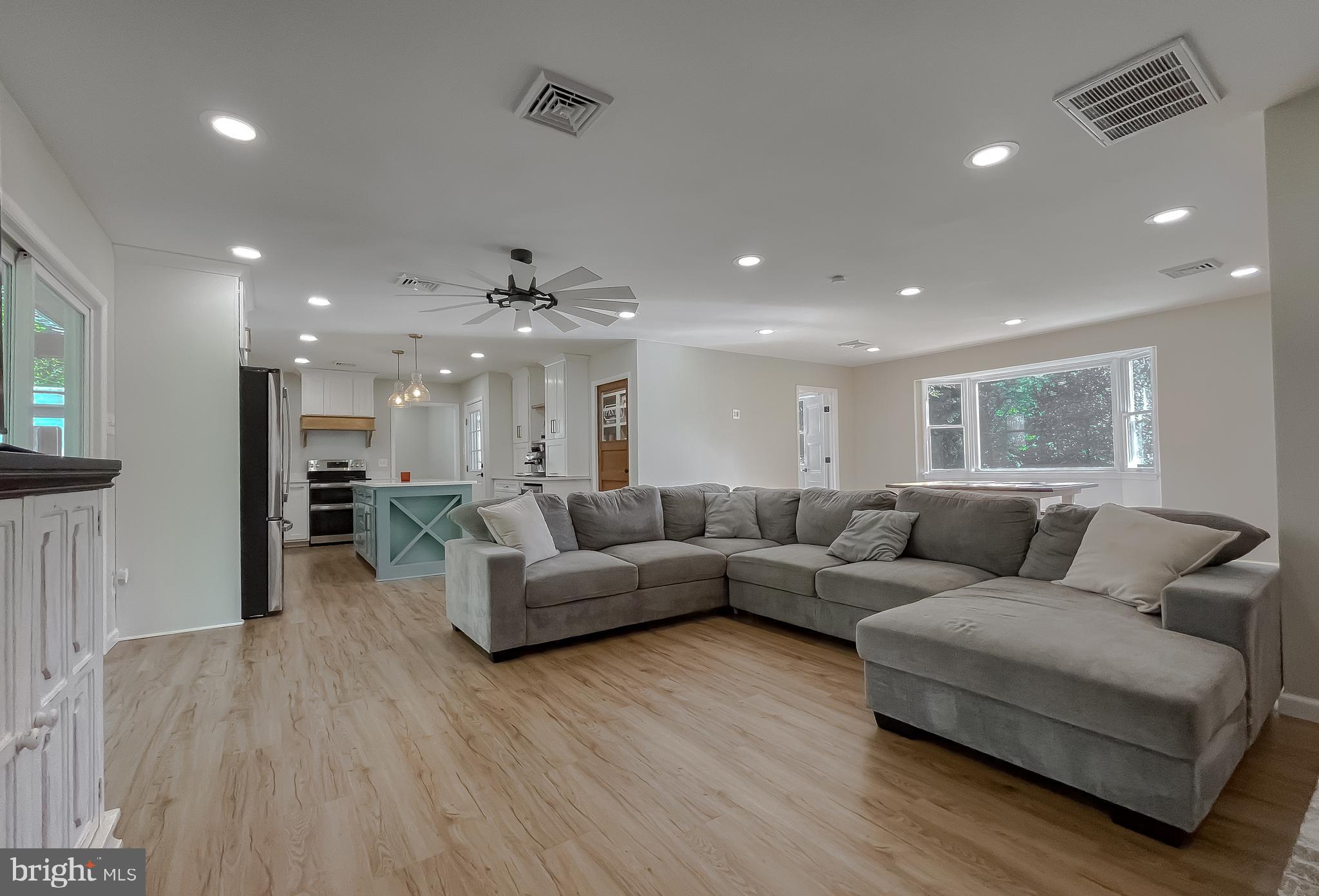 26005 Jones Wharf Road Hollywood, MD 20636 - Photo 20 of 66 a living room with furniture and a wooden floor