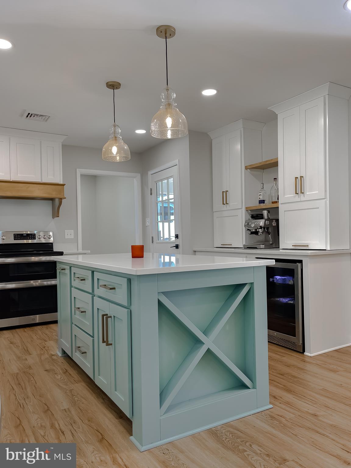 26005 Jones Wharf Road Hollywood, MD 20636 - Photo 22 of 66 a kitchen with kitchen island granite countertop a sink cabinets and stainless steel appliances