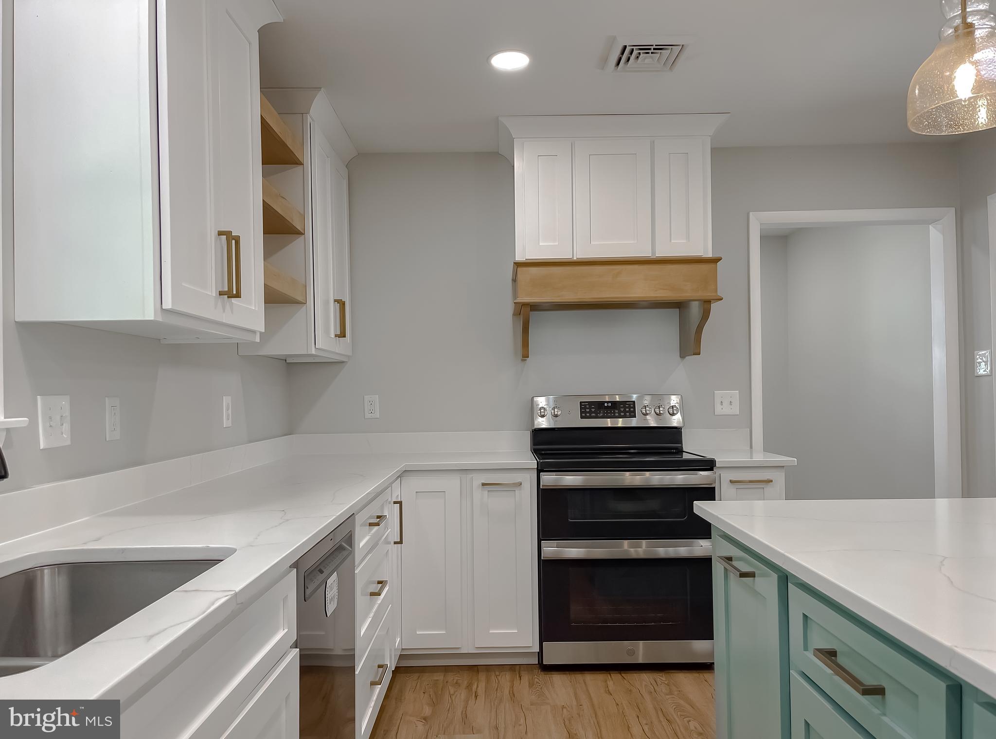 26005 Jones Wharf Road Hollywood, MD 20636 - Photo 23 of 66 a kitchen with granite countertop a stove and a sink