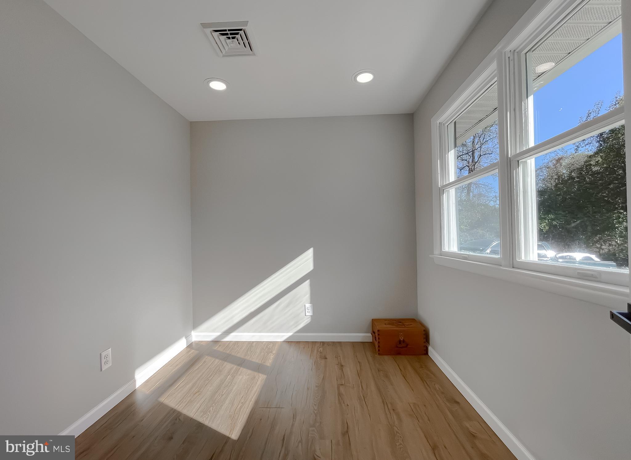 26005 Jones Wharf Road Hollywood, MD 20636 - Photo 39 of 66 a view of a room with wooden floor and a window