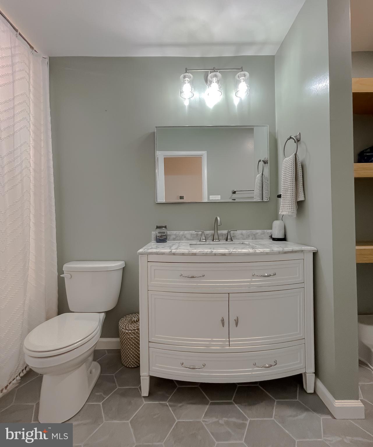 26005 Jones Wharf Road Hollywood, MD 20636 - Photo 44 of 66 a bathroom with a toilet sink and mirror