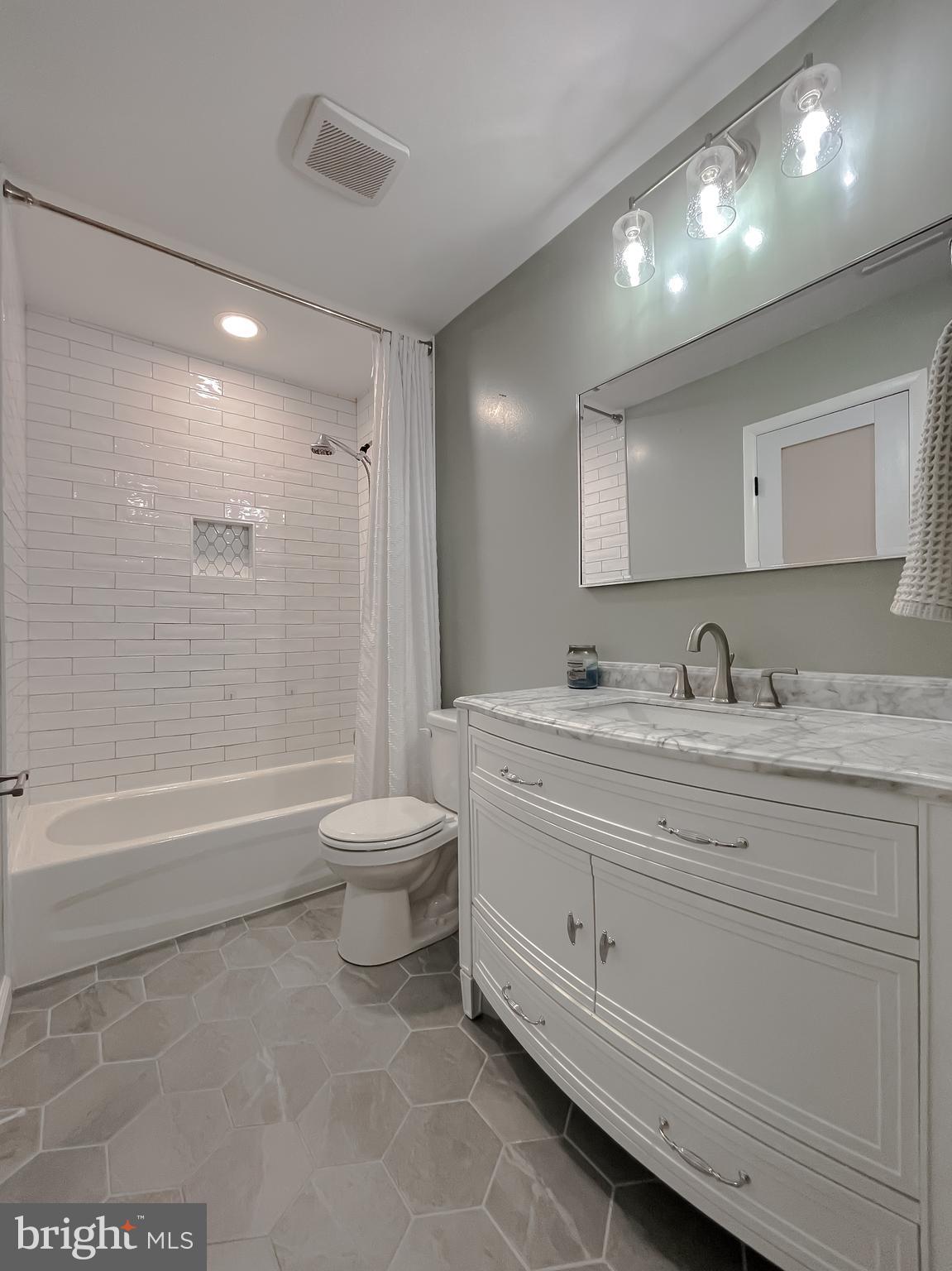 26005 Jones Wharf Road Hollywood, MD 20636 - Photo 46 of 66 a bathroom with a granite countertop sink a toilet and a bathtub