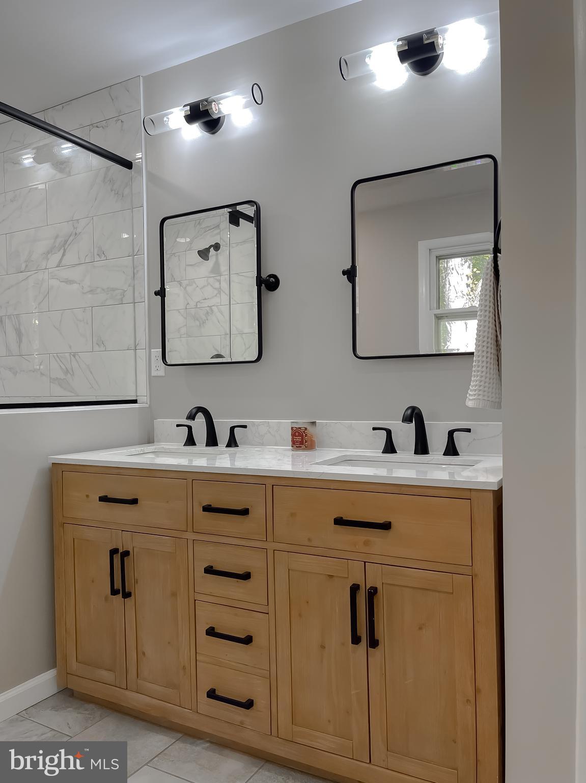 26005 Jones Wharf Road Hollywood, MD 20636 - Photo 52 of 66 a bathroom with a sink and a mirror