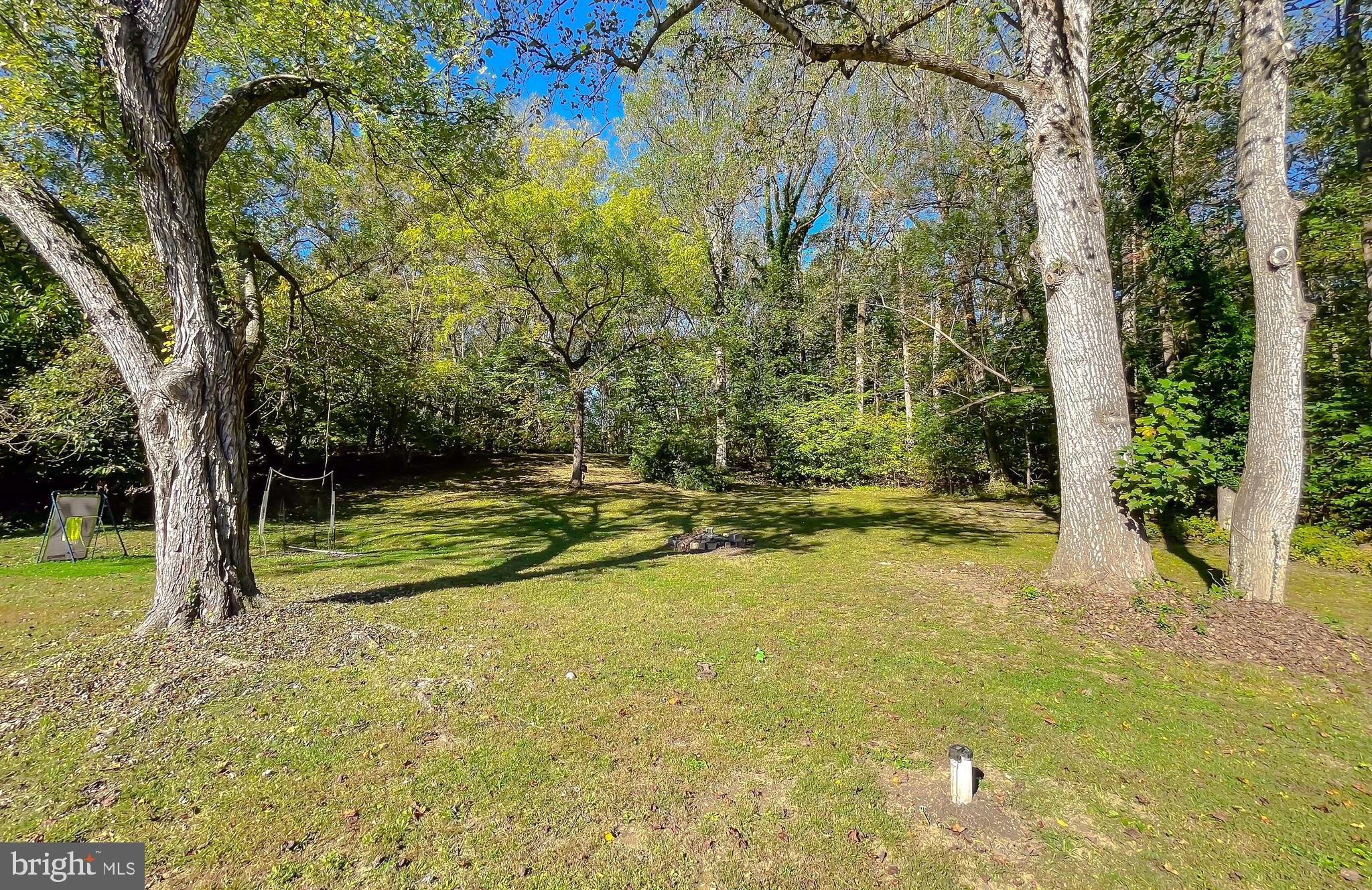 26005 Jones Wharf Road Hollywood, MD 20636 - Photo 62 of 66 a view of a swimming pool with an outdoor space