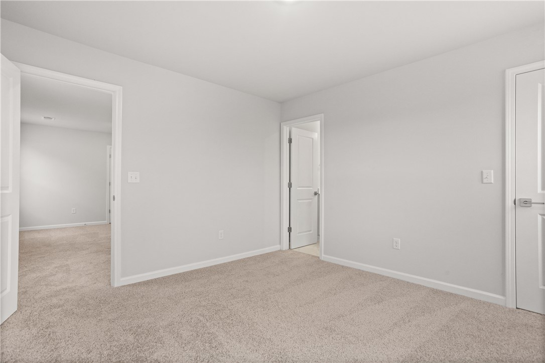 631 Sweetspire Trail, Unit 148 Seneca, SC 29678 - Photo 26 of 36 A spacious room offers comfortable carpeting, ready for personalization.