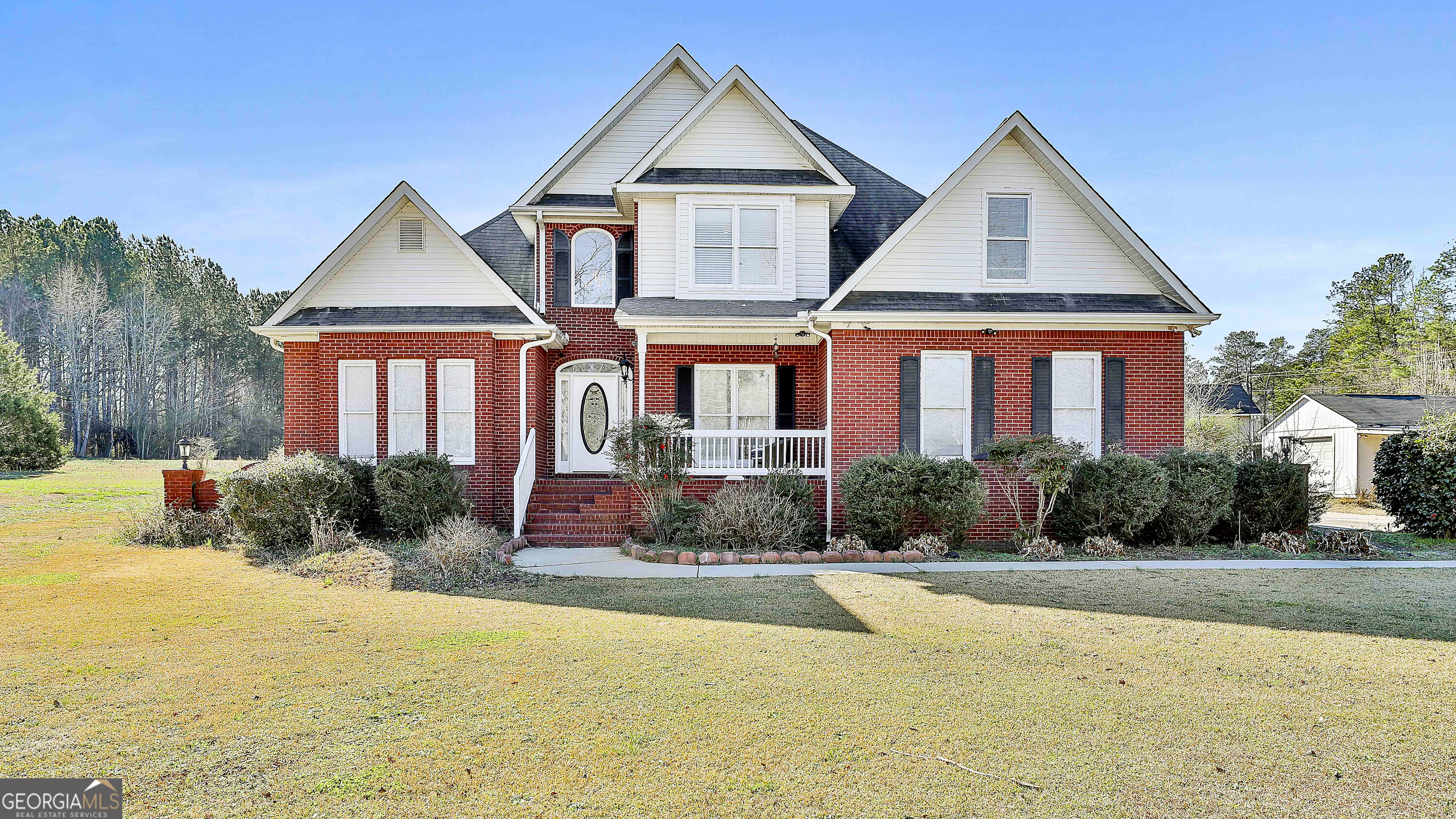 a front view of a house with a yard