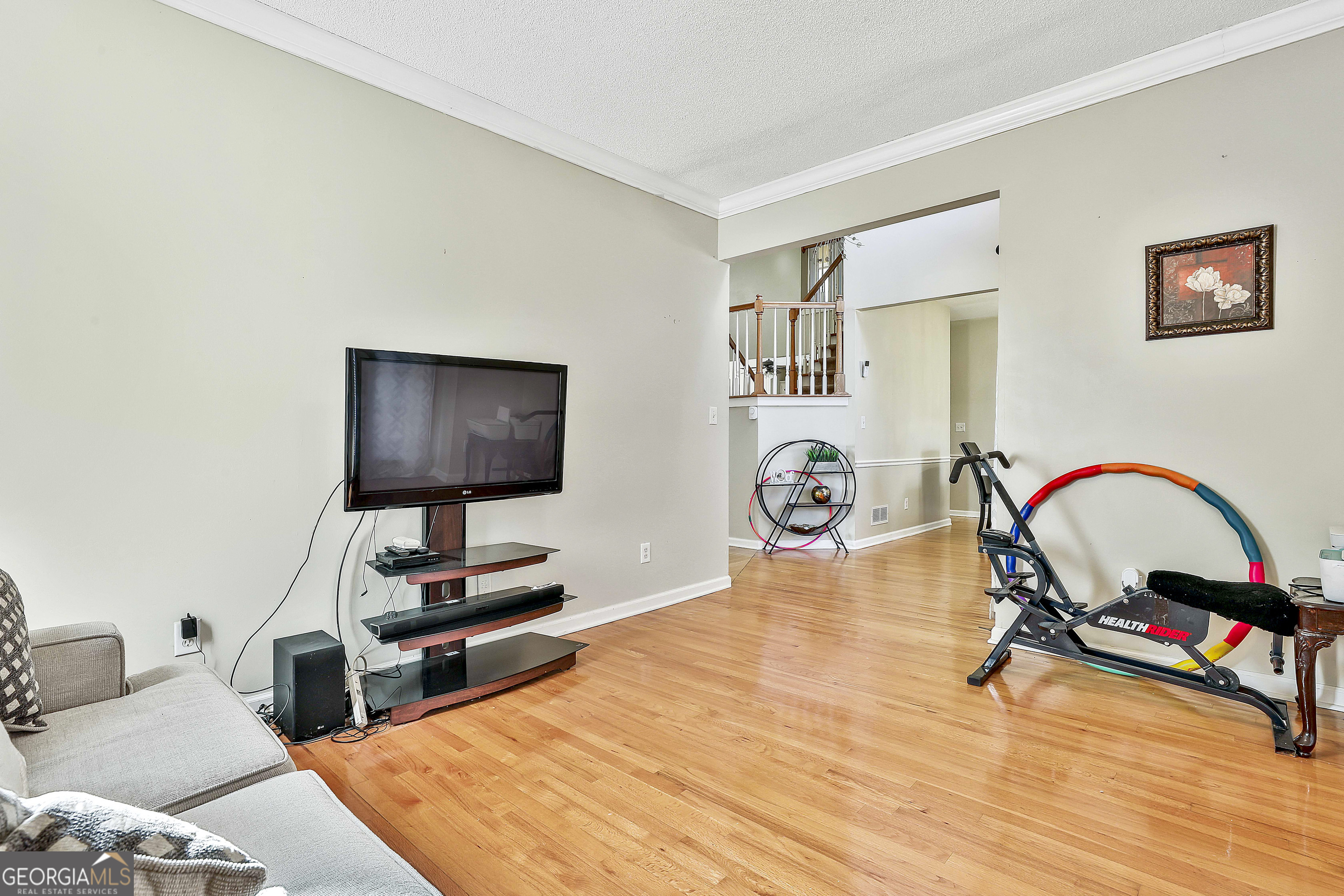 1317 Cheatham Road Griffin, GA 30223 - Photo 15 of 41 a bedroom with furniture and a flat screen tv