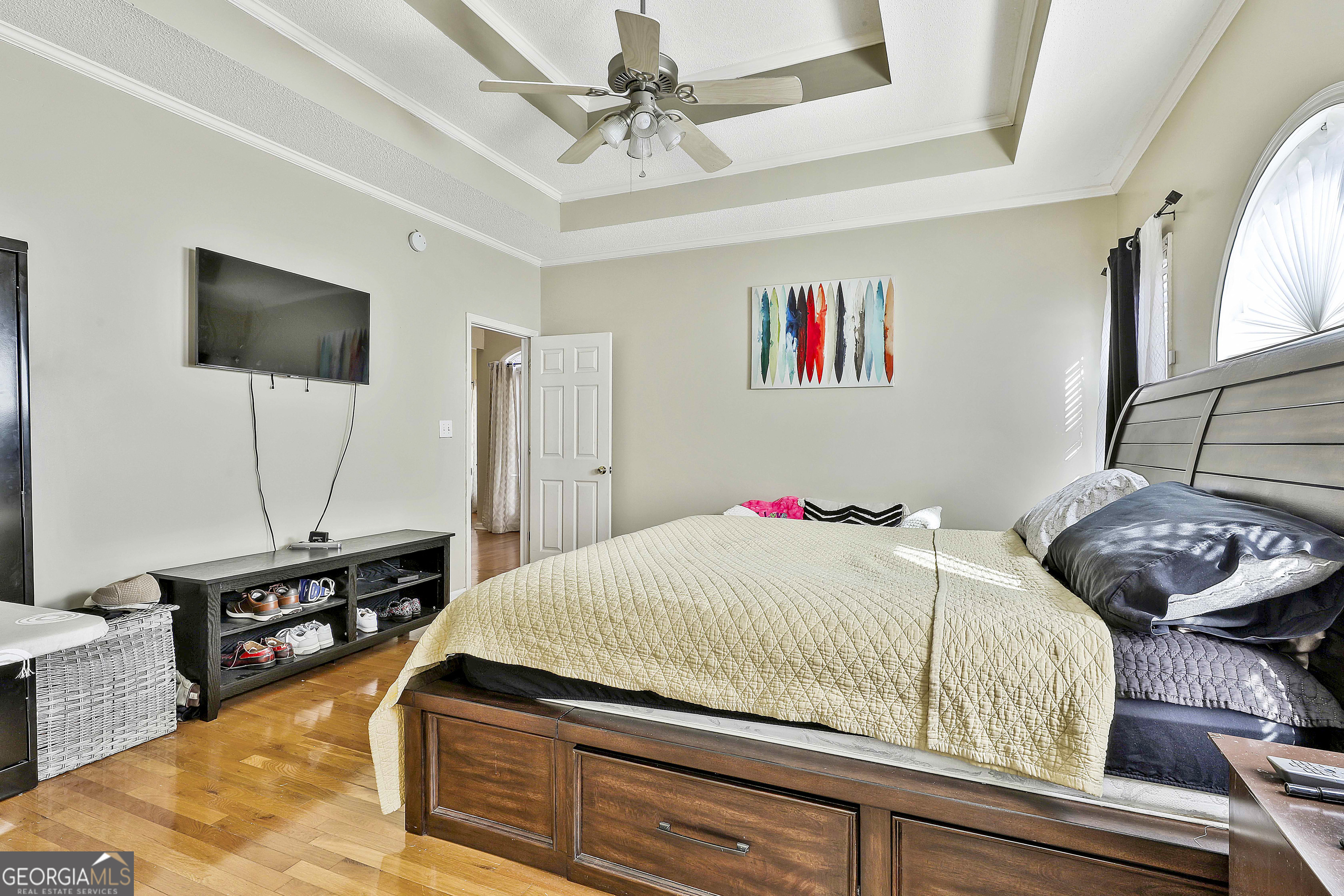 1317 Cheatham Road Griffin, GA 30223 - Photo 17 of 41 a bedroom with a bed and a flat screen tv