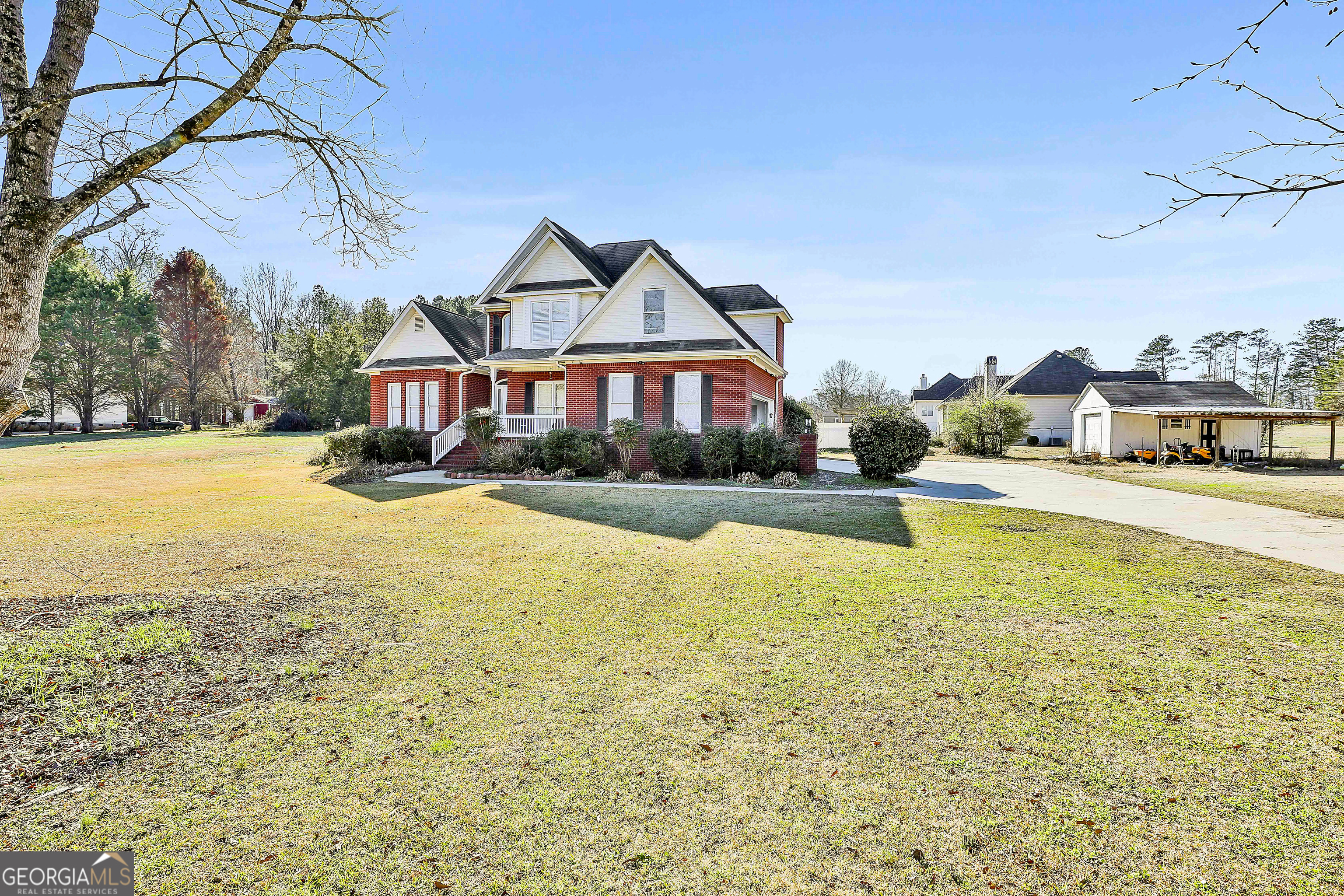 1317 Cheatham Road Griffin, GA 30223 - Photo 2 of 41 a view of a swimming pool with lawn chairs and plants