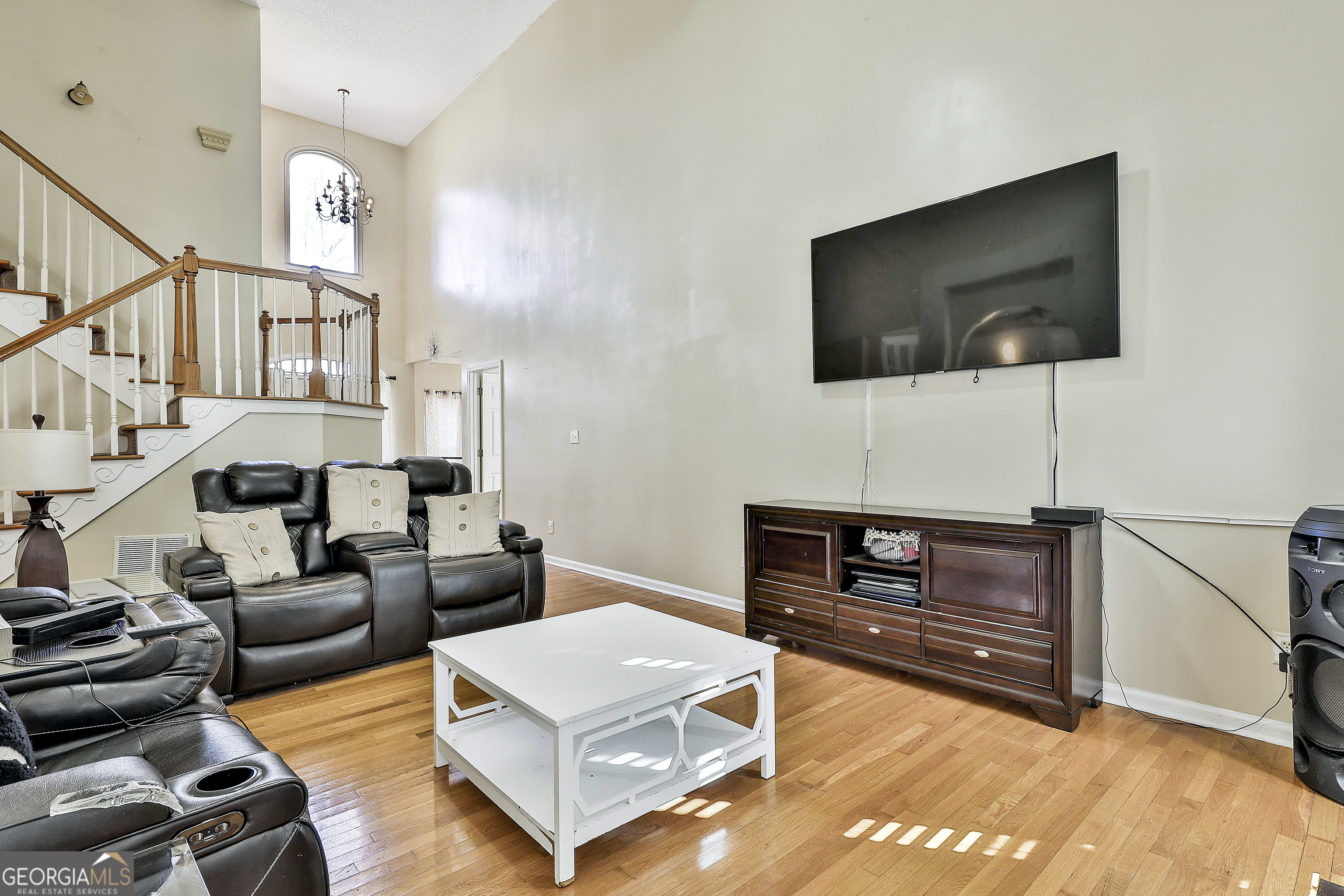 1317 Cheatham Road Griffin, GA 30223 - Photo 23 of 41 a living room with furniture and a flat screen tv