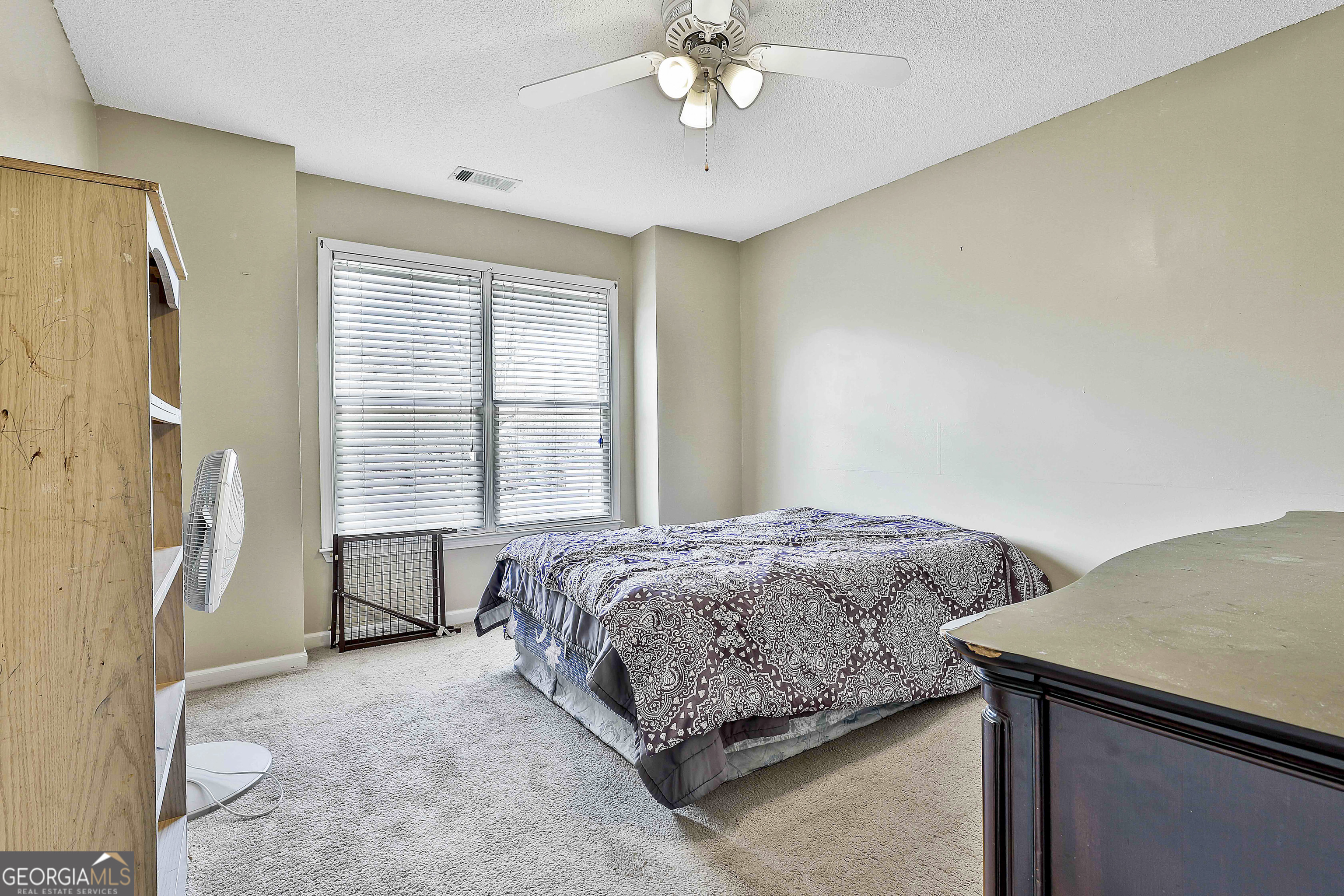 1317 Cheatham Road Griffin, GA 30223 - Photo 33 of 41 a bedroom with a bed and a table