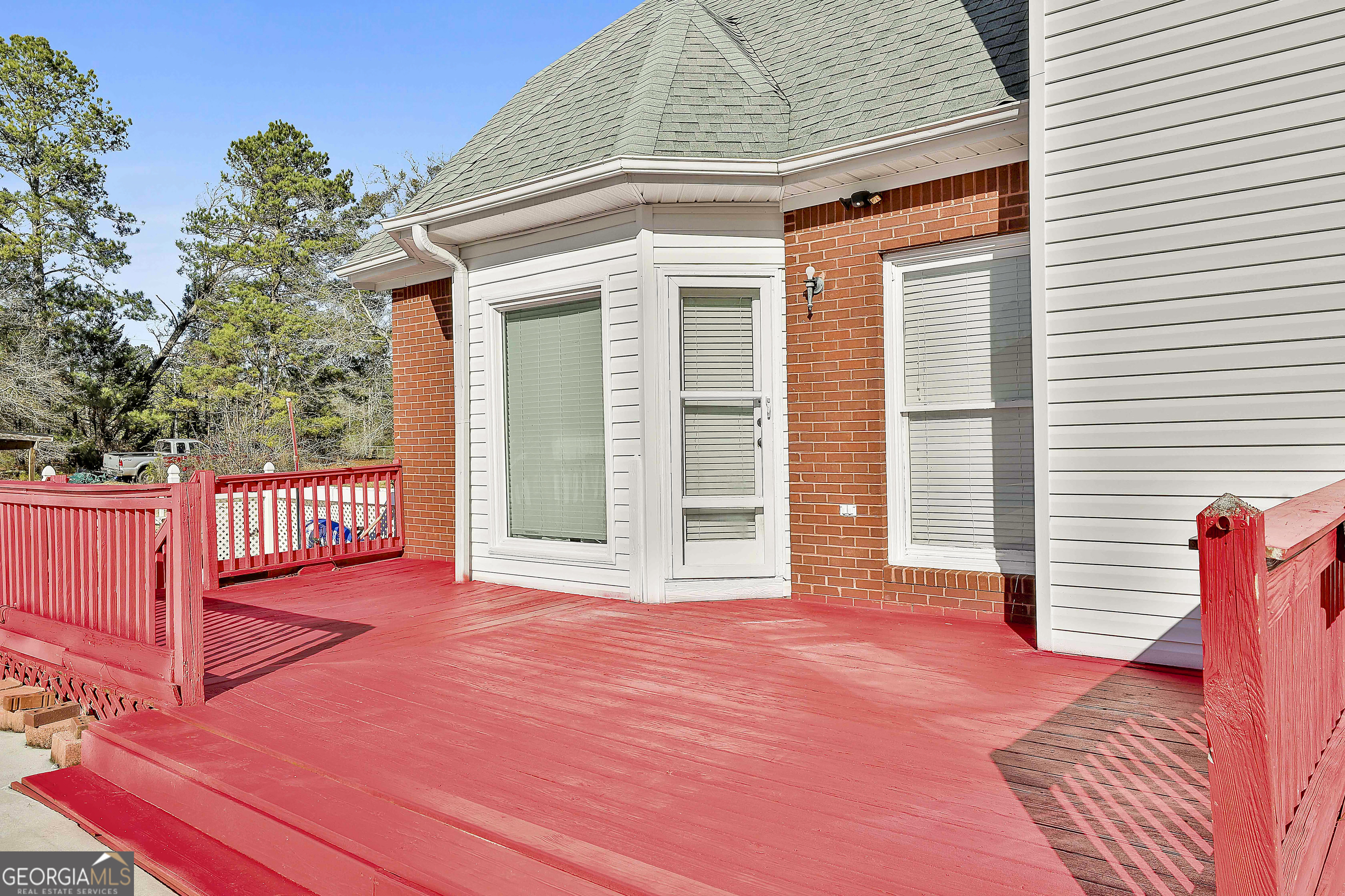 1317 Cheatham Road Griffin, GA 30223 - Photo 38 of 41 a view of a backyard with wooden floor and fence