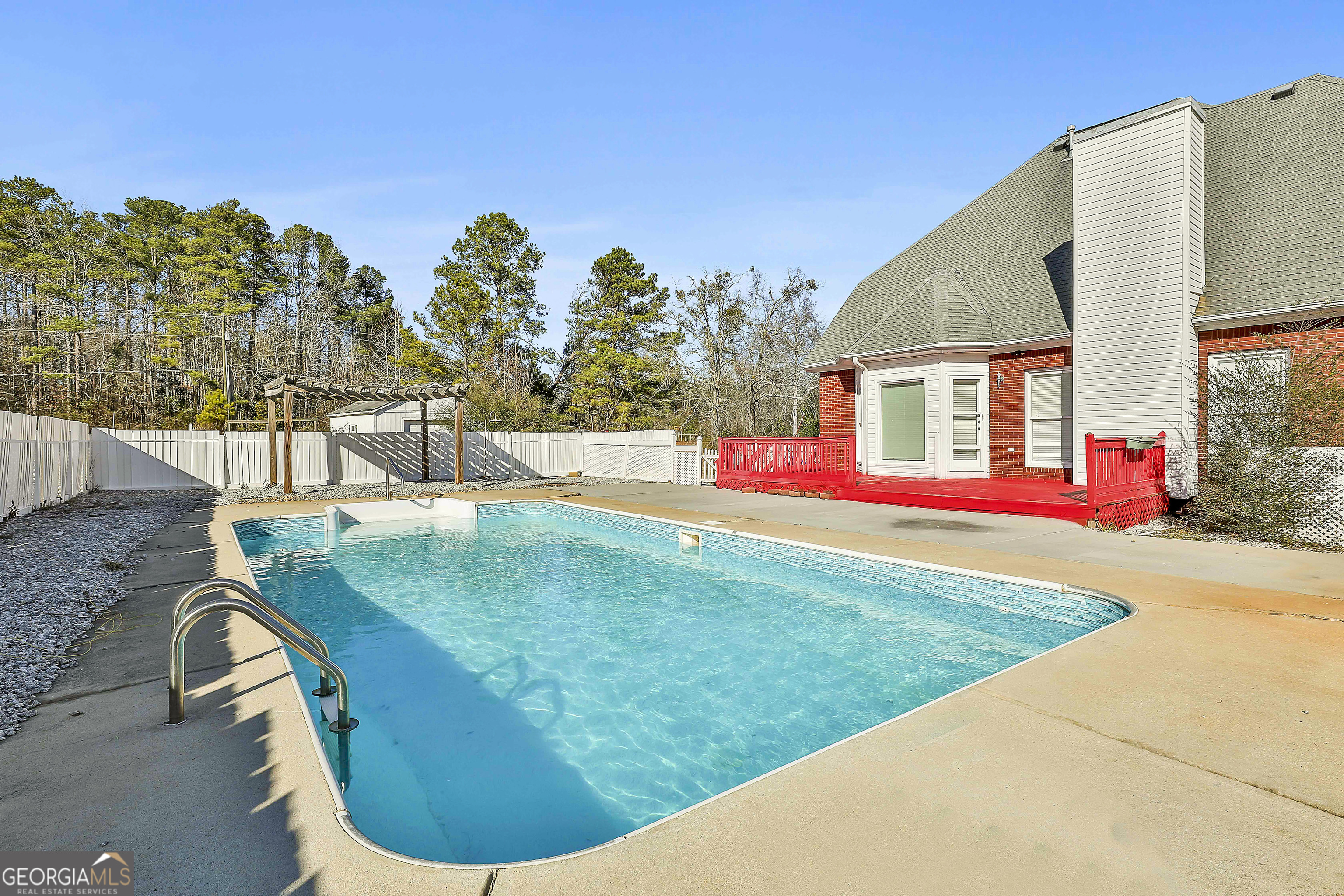 1317 Cheatham Road Griffin, GA 30223 - Photo 40 of 41 a view of outdoor space yard deck and swimming pool