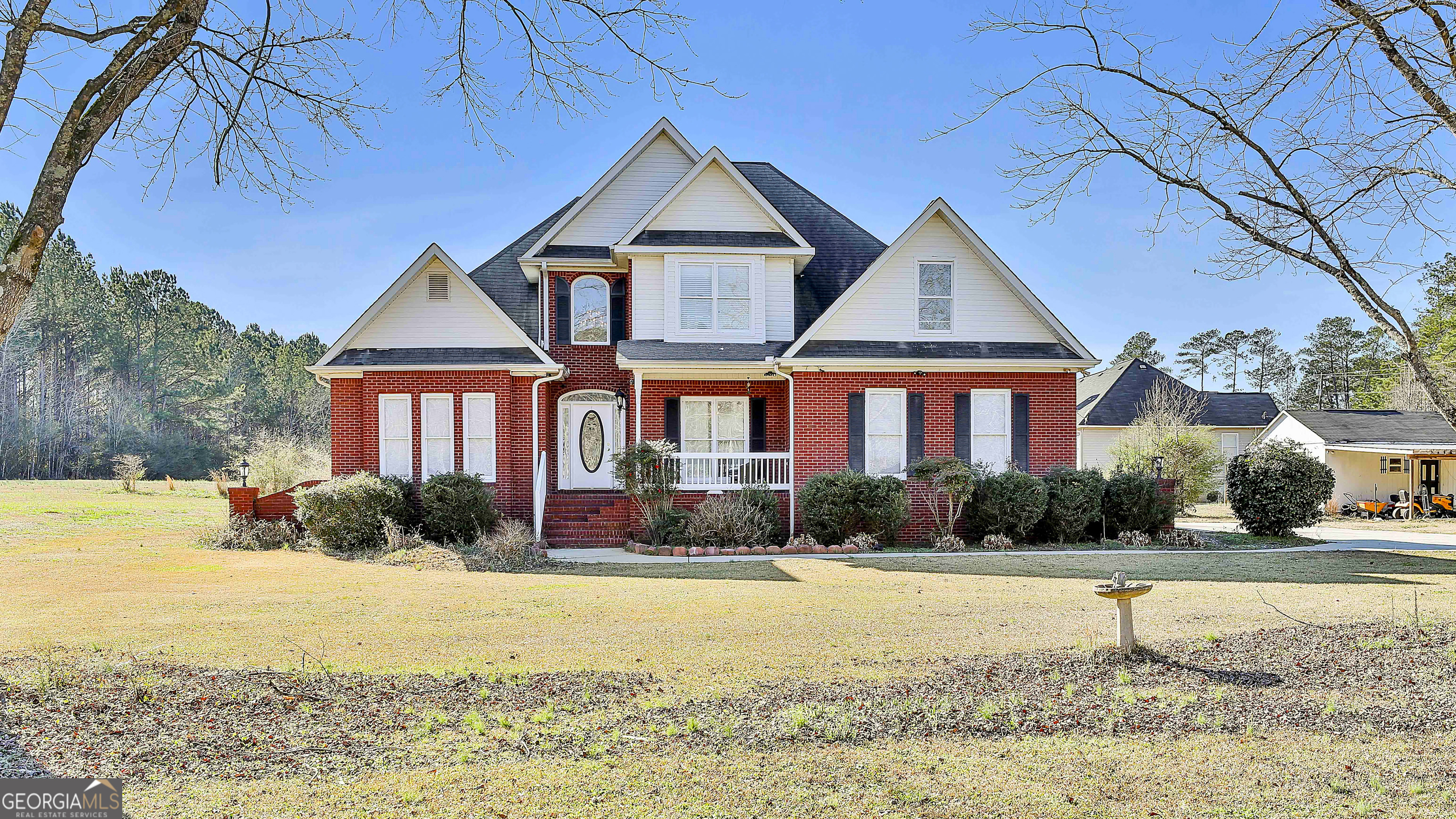 1317 Cheatham Road Griffin, GA 30223 - Photo 4 of 41 a front view of a house with garden
