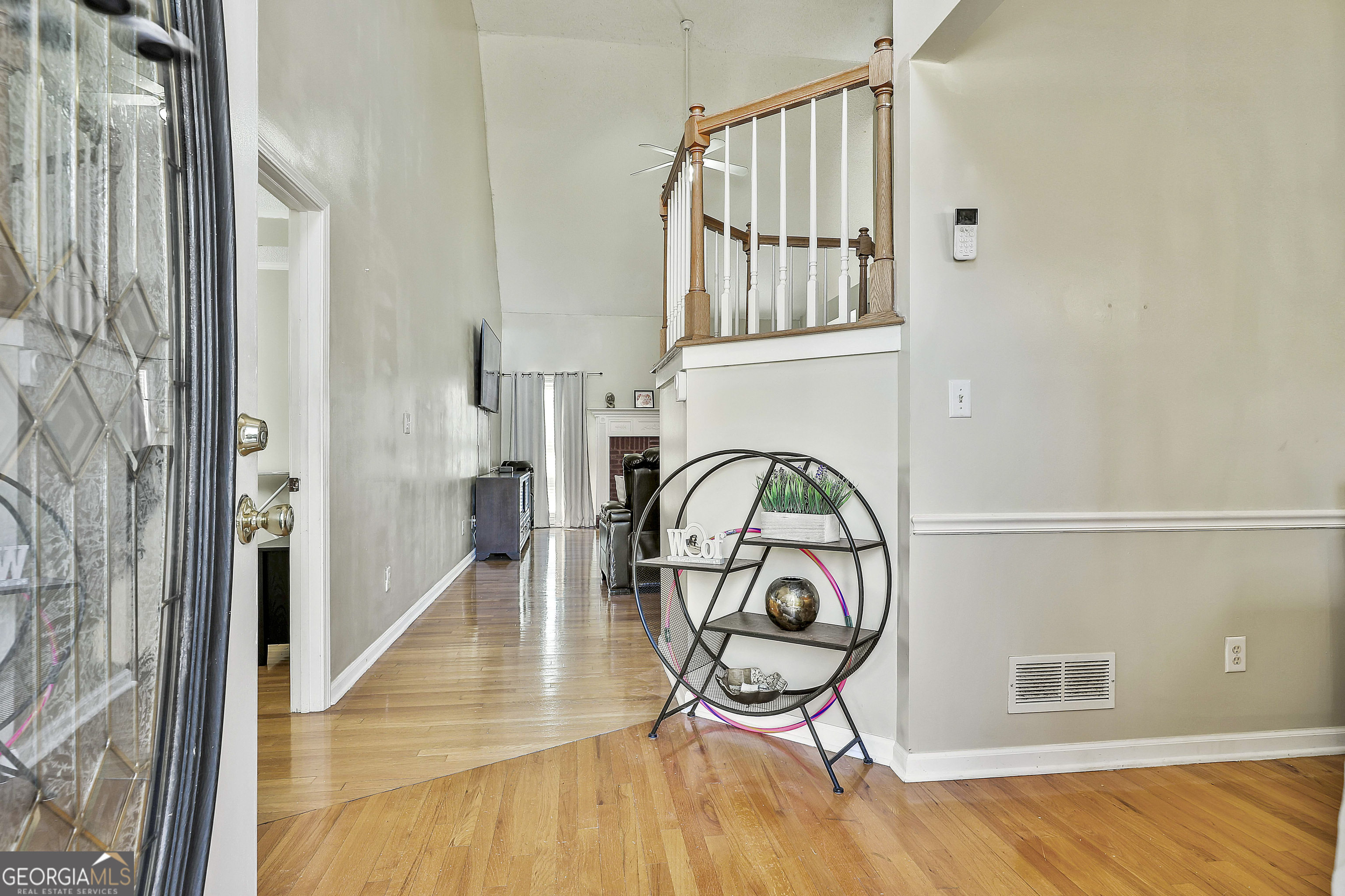 1317 Cheatham Road Griffin, GA 30223 - Photo 8 of 41 a view of a hallway with wooden floor and entryway