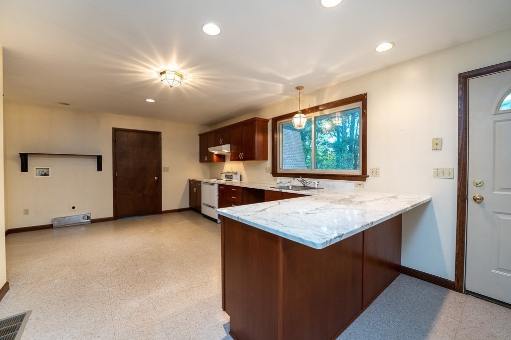 98 Fomer Road Southampton, MA 01073 - Photo 7 of 42 a kitchen with kitchen island a sink stainless steel appliances and window