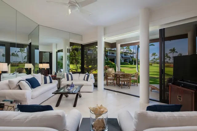 a view of a chairs and table in backyard