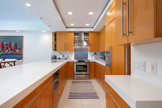 a view of living room with granite countertop furniture and a fireplace