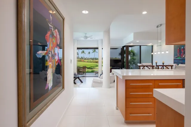 a spacious bedroom with a bed and a flat screen tv