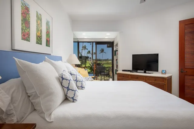 a large bathroom with a granite countertop sink a mirror and shower