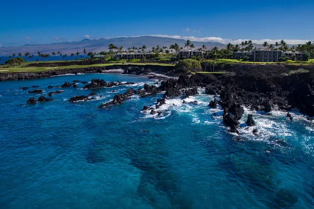 a front view of a house with swimming pool having outdoor seating