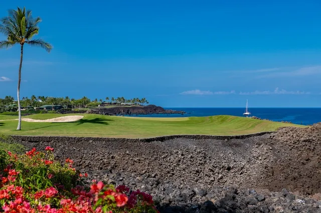 a view of a golf course with a lake