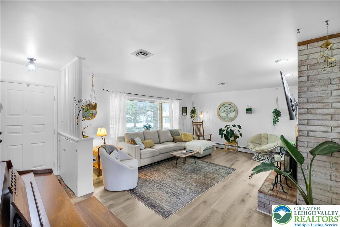 5747 Kernsville Road Orefield, PA 18069 - Photo 10 of 56 a living room with furniture and window