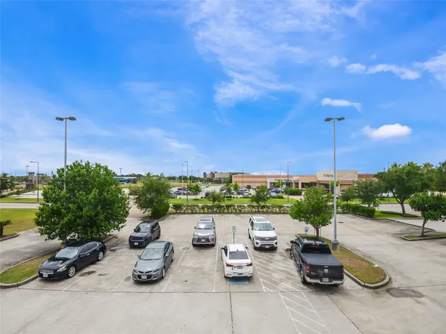 a view of a patio with chairs and plants