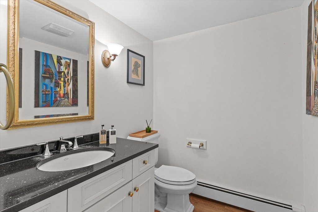 7 Kimball Road Boxford, MA 01921 - Photo 14 of 41 a bathroom with a granite countertop sink mirror vanity and toilet
