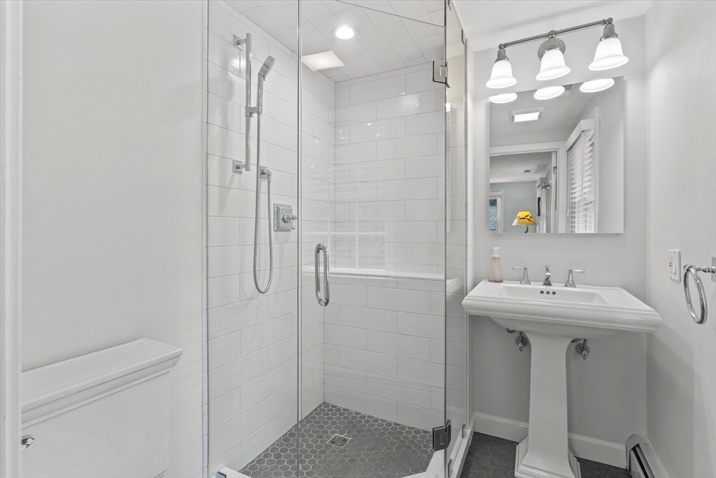 7 Kimball Road Boxford, MA 01921 - Photo 23 of 41 a bathroom with a sink a toilet a large mirror and shower