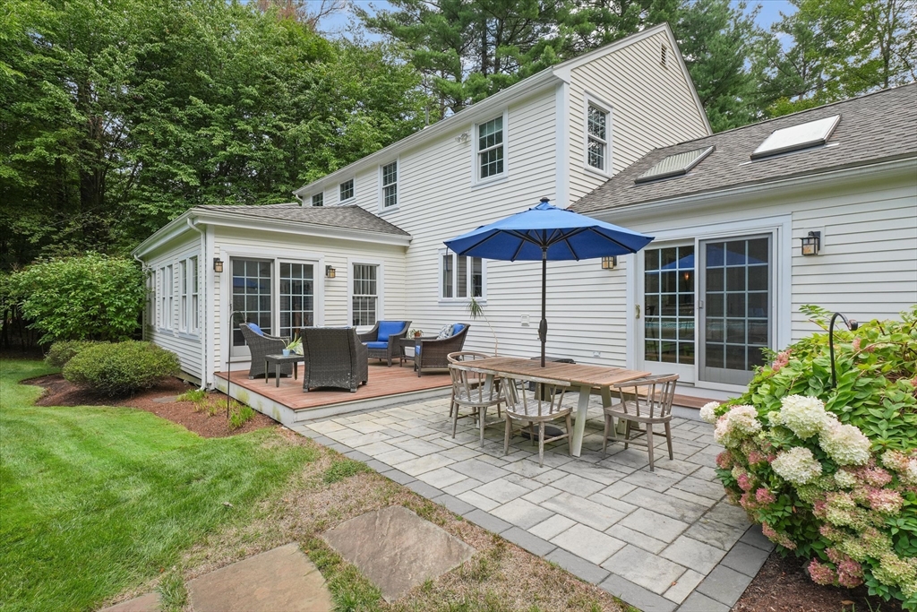 7 Kimball Road Boxford, MA 01921 - Photo 33 of 41 a view of a house with backyard sitting area and garden