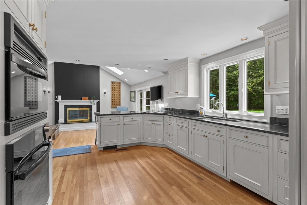 7 Kimball Road Boxford, MA 01921 - Photo 6 of 41 a kitchen with stainless steel appliances granite countertop a stove and a sink
